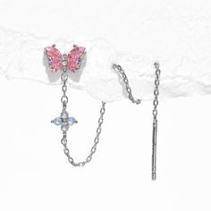 Featuring our signature Flutter Love butterfly design, this earring will effortlessly elevate your style and add a touch of ethereal allure to any outfit! Our Flutter Love Threader Earrings feature an adorable and captivating pink butterfly stud connected to a delicate threader chain. The chain is embellished with a single blue flower blossom and creates a graceful dangle effect. Customize your look by adjusting the length of the chain to suit your preference! Single Blue Flower, Love Butterfly, Threader Earrings Gold, Threader Earrings, Pink Butterfly, Single Earring, Blossom Flower, Girls Earrings, Jewelry Cleaner