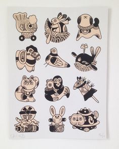 an image of various stickers on a white wall with black and tan inks