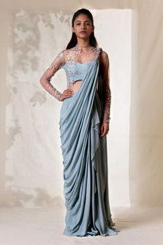 Frost blue saree gown with pearl, sequin scattered embroidered detail, pearl knotted on shoulder, sheer sleeves and drape detail.
Component: 1
Embroidered
Neckline: Round
Sleeve Length: Full
Fabric: Viscose Crepe
Color: Blue
Sheer back
Closure: Back zip - Aza Fashions Grecian Gown, Saree Gowns, Lavender Gown, Drape Sarees, Gown For Women, Saree Gown, Drape Saree, Embroidered Saree, Blue Saree