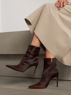 “Real luxury in shoes lies in the pleasure of slipping them on," says Gianvito Rossi, whose footwear is made with an equal focus on comfort and quality. These 'Linsay' ankle boots have been crafted in Italy from soft calf hair and are set on slender 95mm heels. Discreet buckled straps adorn the shaft. Luxury Chic Calf Hair Boots, Luxury Boots With Calf Hair And Leather Sole, Luxury Women's Calf Leather Booties, Luxury Calf Leather Wingtip Boots, Luxury High Ankle Mid-calf Boots In Calf Leather, Luxury Calf Leather Mid-calf Boots With High Ankle, Luxury Calf Leather Shoes With Buckle Closure, Luxury Calf Leather Booties With Reinforced Heel, Luxury Mid-calf Boots With Leather Sole And Snip Toe