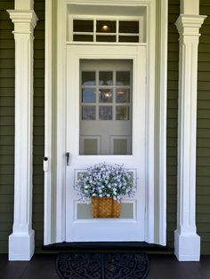 the front door is decorated with white flowers