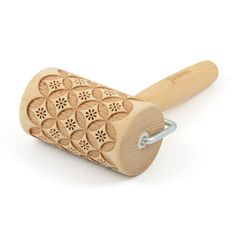 a wooden rolling pin with an intricate design on it