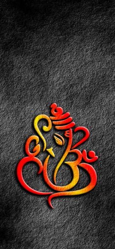 the om shanti symbol is painted in red, yellow and orange on a black background