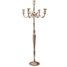 a metal candelabra with three candles on it's sides and four arms