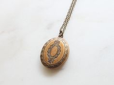 "Vintage style Oval Locket Necklace / Long Chain Oval Locket Necklace / Simple Oval Locket / Initial Disc Locket / Personalized Locket / Grandma Gift / Mothers day Gift / Bridesmaid Gift / Dainty Necklace / Birthday Gift / Gift idea ■ ITEM DETAILS: +Materials : ▶ Locket, Chain - silver burnish plated over brass, gold burnish plated ▶ Initial coin - Sterling silver, Brass +Size : ▶ Locket - 12mm * 19mm (outer size) ▶ Initial coin - 9mm +Chain Length ▶ If you want a chain length other than the opt Ornate Oval Locket Necklace For Wedding, Oval Vintage Charm Locket Necklace For Wedding, Wedding Vintage Charm Oval Locket Necklace, Wedding Oval Pendant Locket Necklace In Antique Gold, Antique Gold Oval Pendant Necklace For Wedding, Antique Gold Oval Locket Necklace For Wedding, Antique Gold Oval Pendant Jewelry For Wedding, Antique Gold Oval Pendant For Wedding, Antique Gold Locket Necklace For Wedding