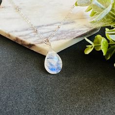 * Elevate your style with our exquisite Moonstone Pendant Necklace.  Handmade with sterling silver or 14k gold filled, this necklace features a stunning teardrop moonstone that radiates elegance and charm.  Perfect for weddings or as a birthday gift, this necklace is adorned with the June birthstone, symbolizing love and new beginnings. With its timeless design and high-quality materials, this necklace is a must-have addition to any jewelry collection. * Gemstone: AAA+ highest quality faceted Ra Teardrop Necklace With Moon Charm As Gift, Teardrop Moon Charm Necklace As Gift, Dainty Moonstone Teardrop Pendant Necklace, Teardrop Moon Charm Necklace For Gift, Faceted Moonstone Necklace Gift, Wedding Teardrop Necklace With Natural Stones, Spiritual Teardrop Hypoallergenic Jewelry, Hypoallergenic Teardrop Moonstone Jewelry, Spiritual Hypoallergenic Teardrop Jewelry