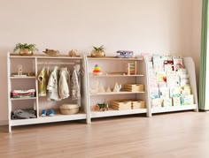 a child's room with shelves and toys on the floor