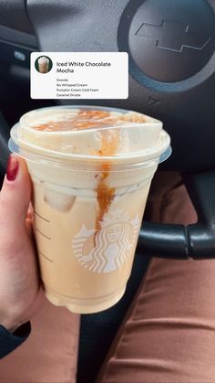 a woman holding up a cup of iced coffee in her hand with an instagram sticker on it