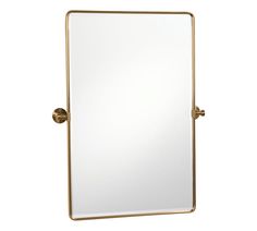 a gold framed mirror sitting on top of a white wall next to a faucet