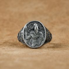 a silver ring with an eagle on it