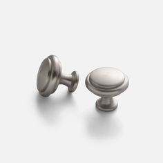 a pair of knobs on a white background