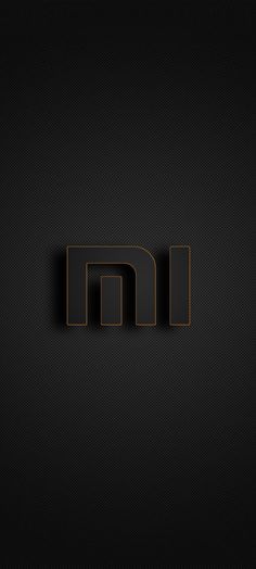 the letter m is made up of black and brown squares with an orange stripe around it