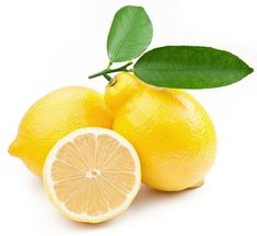 two lemons with leaves and one cut in half