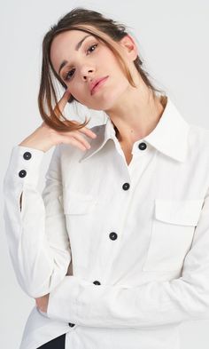 A linen shirt with fitted design, perfect for any woman who wants to stand out from the crowd with her extraordinary style. Features: Two patch front pockets with a flap Long sleeves Long asymmetric tail Made of linen Linen Button-up Work Shirt, Linen Button-up Shirt For Work, Long Sleeve Linen Office Tops, Long Sleeve Linen Tops For Office, Shirt With Buttoned Pockets And Lapel Collar, Linen Button-up Shirt With Flap Pockets, Fall Linen Blouse With Shirttail Hem, Chic Linen Top With Spread Collar, Fitted Tops With Flap Pockets For Spring