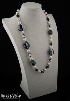 "26\" necklace of handblown glass beads in black & white and a variety of different shapes (2 @ 25x27x15mm, 1 @ 20x23mm, 1 @ 20x19mm, 5 @ 15x12mm), faceted 11mm round Spinel beads, 6mm Swarovski jet crystal bicones, graduated white Baroque pearls ranging from 12 to 10mm, sterling silver box clasp. This truly one-of-a-kind necklace will make a splash with any black, white or black & white outfit you own. The glass beads were created by Patti Walton, a well-known Colorado artist who is fam Elegant Handmade Black And White Jewelry, Black And White Round Bead Jewelry, Elegant White Czech Glass Jewelry, Jet Crystal, Keshi Pearl Necklace, Jewelry Black, White Outfit, Box Clasp, Keshi Pearls