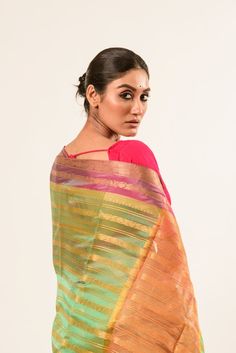 Discover the elegance of our Designer Green Organza Silk Saree featuring a vibrant pink border and luxurious gold strip. Perfect for any occasion. Pink Tissue Silk Saree For Celebration, Elegant Multicolor Blouse Piece For Festive Occasions, Gold Designer Saree In Traditional Drape, Pink Art Silk Traditional Wear With Border, Designer Pink Traditional Wear For Festive Occasion, Designer Pink Traditional Festive Wear, Pink Traditional Wear For Diwali With Border, Elegant Multicolor Zari Weaving Saree, Elegant Multicolor Saree With Zari Weaving