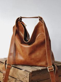 This bag made with a vintage-look, upholstery-weight distressed pu leather which ages beautifully. Wonderfully versatile: can be worn 3 ways - shoulder length, crossbody or handsfree as a backpack. Square Backpack, Women Backpack Travel, Large Leather Tote Bag, Vintage Backpacks, Women Leather Backpack, Elegant Bags, Large Leather Tote, Convertible Backpack, Leather Bag Women