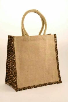 a brown and black animal print bag on a white background with the bottom half of it's handle