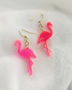 "This cute, retro, hot pink flamingo brings back the kitschy lawn ornament of the 60s, laser-cut from fluorescent neon pink acrylic. Very lightweight and easy to wear all day!  Earring wire is gold and 100% nickel-free. Length of design: 1.75\", length including wire: 2.5\" Makes a great birthday gift, bachelorette party or wedding party favor. Designed and lasercut in Las Vegas, Nevada." Novelty Pink Earrings For Summer, Pink Novelty Earrings For Party, Neon Jewelry For Summer Gifts, Flamingo Neon, Retro Flamingo, Flamingo Design, Wood Earrings Stud, Flamingo Earrings, Lawn Ornament