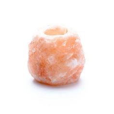 a close up of a small orange object on a white background