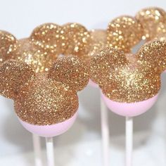 some pink and gold mickey mouse cake pops