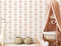 a baby's room with pink and gold wallpaper, a giraffe toy and two baskets on the floor