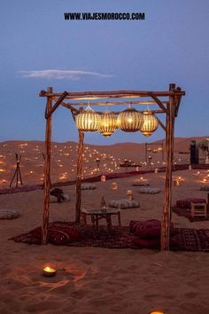 an outdoor wedding setup in the desert at night