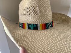 "7/8\" Wide Cactus Hat band All bead work is beaded with 10lb extreme braided nylon line. All hat bands are finished at 23\" with glued than sewed down leather ends and an adjustable leather tie." Adjustable Woven Hat With Flat Crown, Adjustable Multicolor Hat For Western-themed Events, Custom Adjustable Summer Hat Bands, Western Woven Fedora Hat Bands, Country Style Woven Hat Band For Rodeo, Adjustable Artisan Hat Bands For Ranch, Western Multicolor Hat Bands For Rodeo, Western Handwoven Hat Bands For Rodeo, Adjustable Western Woven Hats