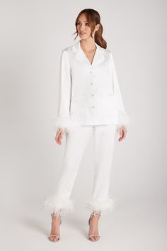 DESCRIPTION & FEATURES Meet DARCIE. Our MERABI Pajamas are now in White. Perfect for the bride herself or a gift for loved ones. Made from our exclusive, beautifully designed silk touch fabric, these little beauties will make you feel amazing. These premium pyjamas are perfect for the complete bridal party to enjoy! Here at NADINE MERABI we have spent time making these fit perfectly and feel wonderful when worn. With a feather trim to the cuff, White satin binding on the shirt and trouser hem cu White Pyjamas, Nadine Merabi, Luxury Pajamas, Red Pajamas, Black Pajamas, Pyjama Satin, White Pajamas, Best Pajamas, David Koma