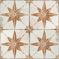 a white and brown tiled floor with star designs