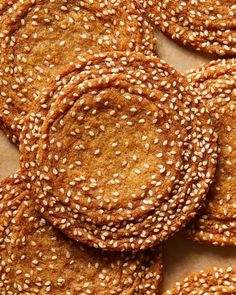 sesame seed cookies are arranged on top of each other