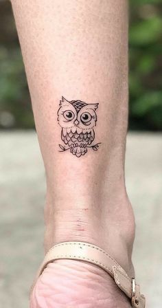 an owl tattoo on the ankle