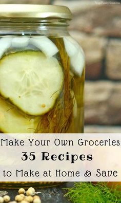 a jar filled with sliced cucumbers next to nuts