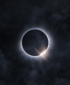 the solar eclipse is seen through clouds in this image