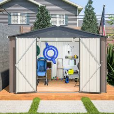 an outdoor storage shed with the doors open