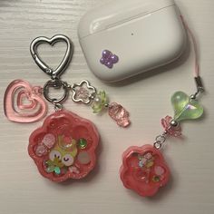 some cute little charms on a table next to an air freshener dispenser