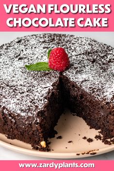 a chocolate cake with a slice taken out of it and the text vegan flourless chocolate cake