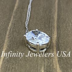 "The pendant pictured is a simulated diamond #6760 -Approximate total carat weight: approx. 3.00ctw diamond equivalent -Center Stone Size: 10x8mm - approx. 3.00ct diamond equivalent -Center Stone Shape: oval -Gem Type: simulated diamond -Stone Clarity: VVS1 -Stone Color: D -Moh's Scale: 8.5 hardness -Metal Type and Purity: 14k white gold -Setting: 4 prong basket head -Chain: 18\" delicate 14k gold chain / heavier option with lobster claw available (use dropdown to select) -Country of Manufacturi Dazzling Oval Necklace With Prong Setting, Diamond Oval Pendant Jewelry With Prong Setting, Formal Solitaire Necklace With Oval Cubic Zirconia Pendant, Formal Cubic Zirconia Solitaire Necklace With Oval Pendant, Oval Diamond Pendant With Prong Setting, Formal Oval Gemstone Solitaire Necklace, Formal Oval Pendant Solitaire Necklace, Oval Pendant Solitaire Necklace In Sterling Silver For Anniversary, Anniversary Oval Solitaire Necklace In Cubic Zirconia