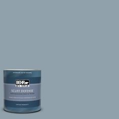 a can of behr paint on a grey background