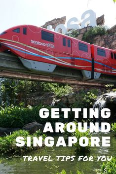 a red train traveling over a bridge with the words getting around singapore travel tips for you