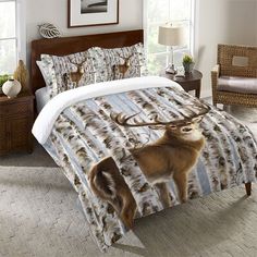 a bed with a deer on it in a bedroom