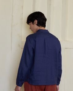 Our collared, long sleeved linen blouse with an henley neckline and delicate buttoning cuffs is a classic, heirloom style shirt crafted in a light weight, zesty rich blue color linen. Perfectly styled under a knitted sweater for that elevated British aesthetic. Garment dyed to a rich blue shade, in a local dye house that proudly uses low impact processing and GOTS certified dyes. DETAILS Blouse Features:- A collared, buttoning henley neckline- Full length sleeves with a button cuff- Slight A-lin Long Sleeve Linen Shirt With Placket, Linen Long Sleeve Top With Button Closure, Long Sleeve Linen Top With Button Closure, Long Sleeve Linen Blouse With Button Closure, Linen Long Sleeve Shirt With Button Closure, Flax Colored Long Sleeve Relaxed Fit Blouse, Classic Long Sleeve Flax Tops, Flax Long Sleeve Relaxed Fit Blouse, Flax Long Sleeve Shirt With Button Closure