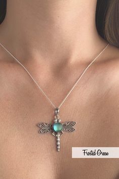 If a dragonfly lands on you, it's good luck! Add some fun to your outfit with this beautifully designed sterling silver and crystal Dragonfly Pendant by LeightWorks. Our handmade necklace is a great statement piece, with glowing crystal surrounded by intricate silver details in the dragonfly wings and body. Wear our pendant on a chain or try it with one of our silver swirl or slide chokers for an even bolder look. Sterling silver components. Sterling silver .7mm box chain, 18" included with pend Elegant Sterling Silver Dragonfly Jewelry, Bohemian Silver Dragonfly Necklace, Nickel-free Sterling Silver Dragonfly Jewelry, Elegant Sterling Silver Dragonfly Necklace, Handmade Sterling Silver Dragonfly Jewelry, Dragonfly Shaped Sterling Silver Jewelry Gift, Sterling Silver Dragonfly Jewelry Gift, Silver Dragonfly Jewelry, Sterling Silver Dragonfly Necklace