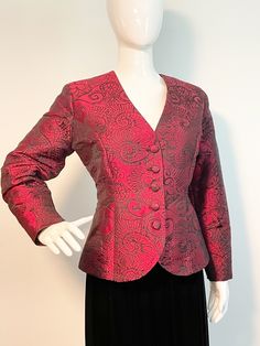 This is a beautifully tailored wine colored blazer.  It has an abstract floral design woven in black.  The jacket is fully lined and has light shoulder pads.  Buttons down the front with fabric covered buttons.  Appears to be custom made, incredible quality with taffeta sound and feel.  The perfect accompaniment to your LBD.  Size tag M.  No flaws noted. Check measurements carefully, no stretch. Measurements taken with jacket laying flat and doubled where appropriate. In order to determine fit w Fitted Red Blazer With Buttons, Red Fitted Blazer With Hidden Button Closure, Fitted Burgundy Blazer For Work, Elegant Red Blazer With Button Closure, Elegant Red Blazer With Buttons, Elegant Fitted Red Blazer, Red Fitted Formal Outerwear, Fitted Red Formal Outerwear, Burgundy Formal Blazer