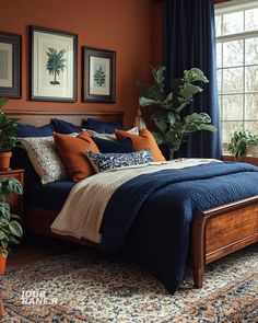 a bedroom with orange walls and blue bedding