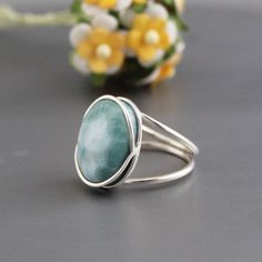 Natural Larimar Ring, Blue Stone Ring, Large Gemstone Silver Ring, Oval Gemstone Ring, Modern Handmade Ring, March Birthstone Jewelry  Healing with Larimar ♥ Facilitating inner wisdom and outer manifestation ✦Gemstone: Natural Larimar ✦Stone Cut: Oval Cabochon ✦Stone Size: Approximately 14X20 ✦Metal: 925 Sterling Silver Natural stones  may vary slightly in shape, size and color. Handmade Item ------------------------------------------------ Looking for the perfect gift that makes a statement? Our handmade jewelry collection offers exquisite pieces suitable for every occasion and every special person in your life. Whether it's for mom, your wife, or your sister, we have a range of styles from bohemian to minimalist, ensuring there's something to suit every taste. Make your bridesmaids feel Blue Larimar Round Rings, Blue Larimar Opal Ring, Blue Larimar Cabochon Rings, Adjustable Blue Larimar Ring, Oval Larimar Rings For Anniversary, Blue Larimar Moonstone Ring, Blue Oval Opal Ring With Natural Stones, Handmade Oval Larimar Turquoise Ring, Oval Larimar Cabochon Rings