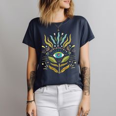 Boho Vision: Eye of Serenity Tee, boho tshirt, minimalist shirt, aesthetic shirt, floral shirt, graphic tshirt, vintage tshirt, womens Festival Graphic Print Relaxed Fit T-shirt, Bohemian Graphic Print T-shirt For Summer, Festival Crew Neck T-shirt With Graphic Print, Bohemian Cotton Tops With Unique Print, Bohemian Cotton Top With Unique Print, Hippie Cotton T-shirt With Graphic Print, Bohemian Spring T-shirt With Graphic Print, Artsy Printed Cotton T-shirt, Festival Relax Fit Graphic T-shirt