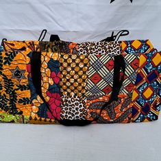 African Fabric Print Holdall Bag | Travel Bag | Weekend Bag Large Vibrant Print Holdall Bag Perfect For Everyday Essentials. Great For Shopping, Gym, Picnic And About Any Occasion. Bag Specifications: Large Twin Handles Zip Closure Guaranteed Cotton Wax Print. 100% Cotton. Strong Sturdy Bag Fully Lined Measurements: Width 25.5 Inches Height 11 Inches Depth 9 Inches Yellow Pouch Box Bag For Travel, Rectangular Duffle Bag With Removable Pouch For Shopping, Multicolor Duffle Bag With Luggage Sleeve For Daily Use, Multicolor Large Capacity Duffle Bag, Multicolor Large Capacity Rectangular Duffle Bag, Orange Pouch Bag For Travel, Everyday Multicolor Travel Bag With Luggage Sleeve, Large Capacity Multicolor Duffle Bag, Orange Travel Pouch Bag