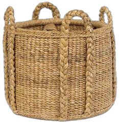 a large woven basket with handles and braiding on the sides, sitting in front of a white background