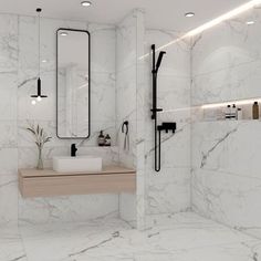 a white bathroom with marble walls and floor